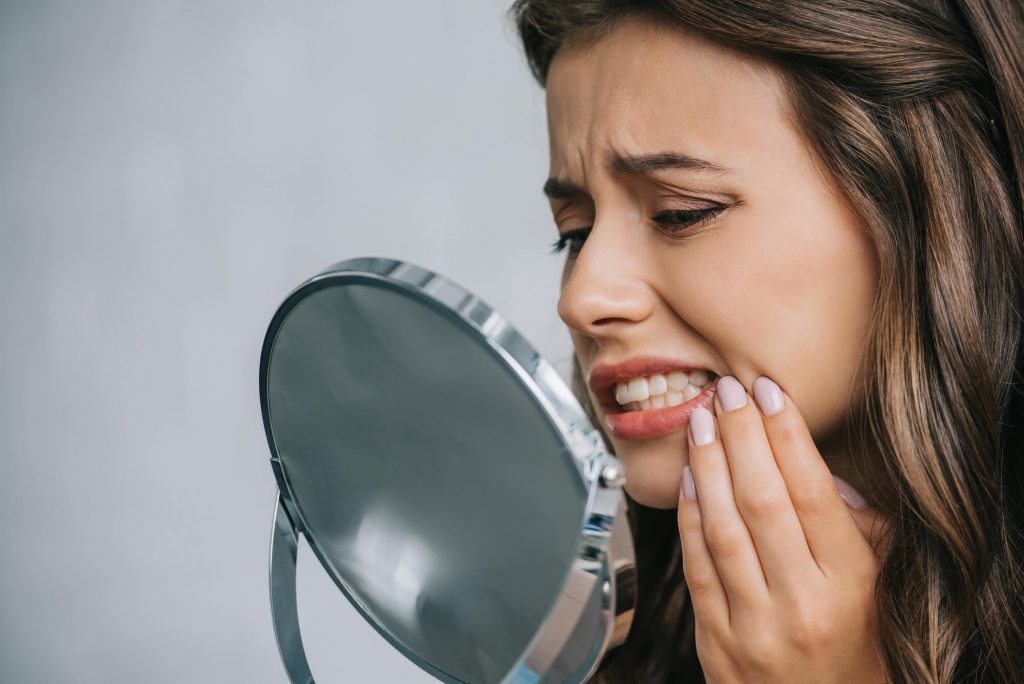 woman tooth extractions greenville sc
