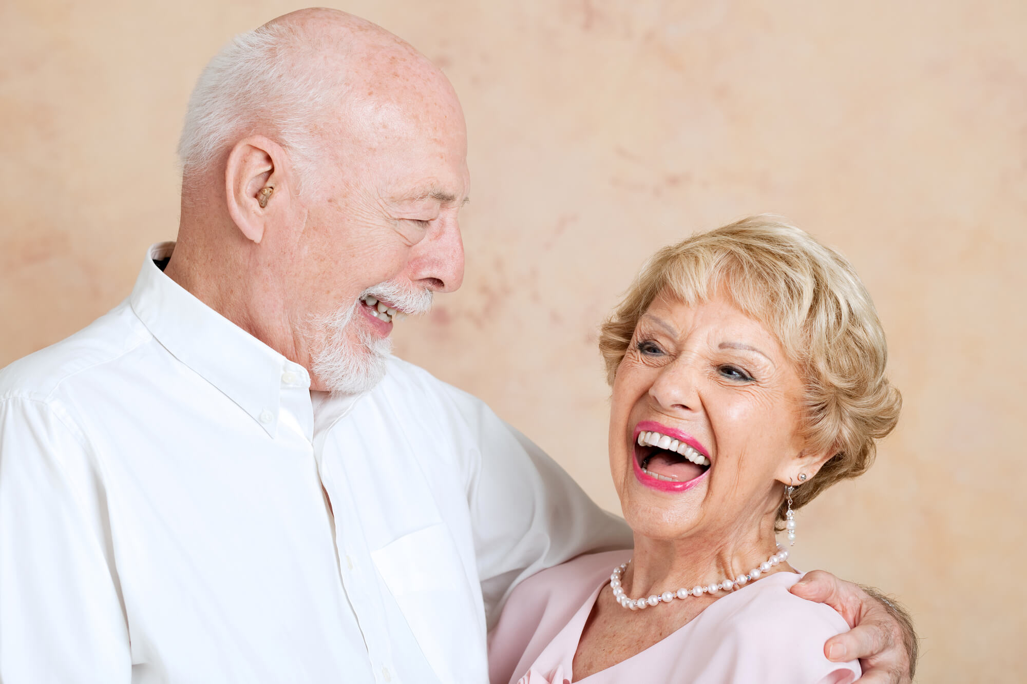 Seniors laughing together and dentures Simpsonville SC