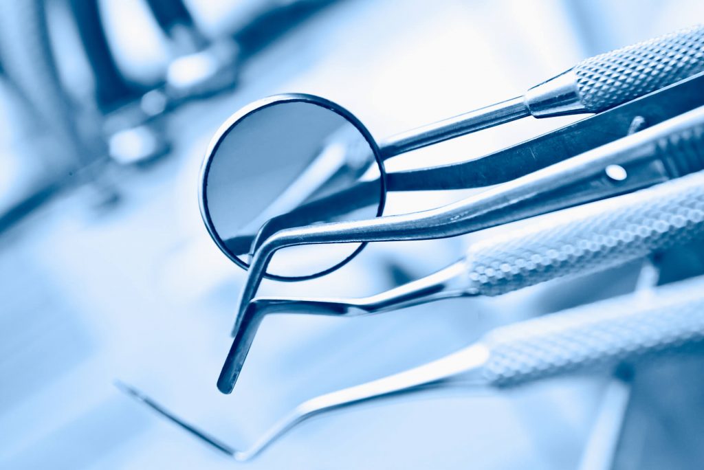 crowns in Simpsonville SC on the dental table with other instruments