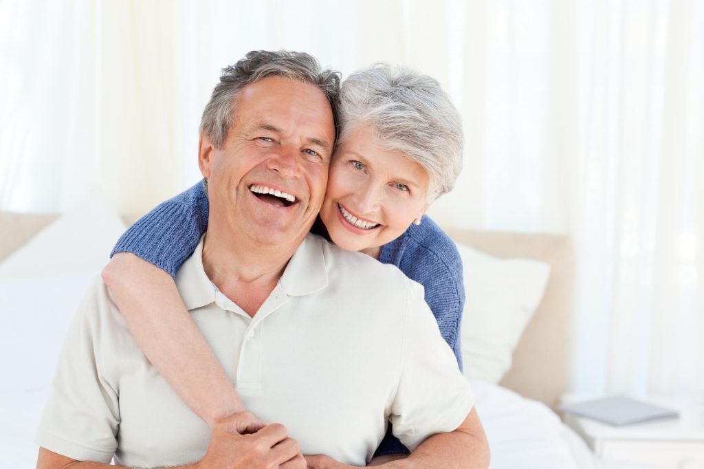 a smiling couple after receiving Family Dentistry in Greenville SC