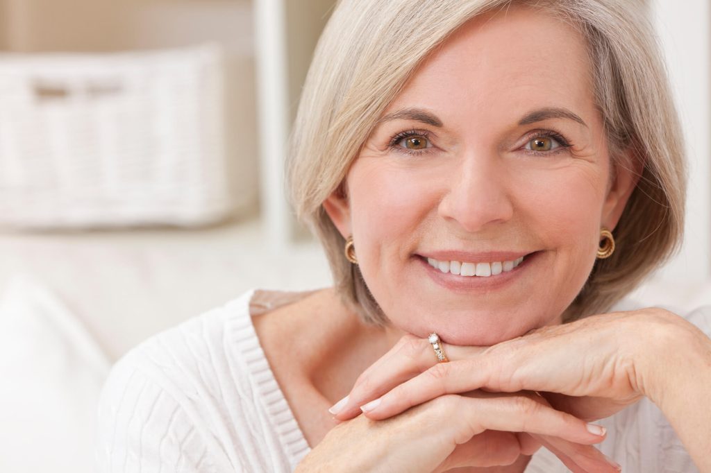 woman wearing dentures in Greenville SC smiling